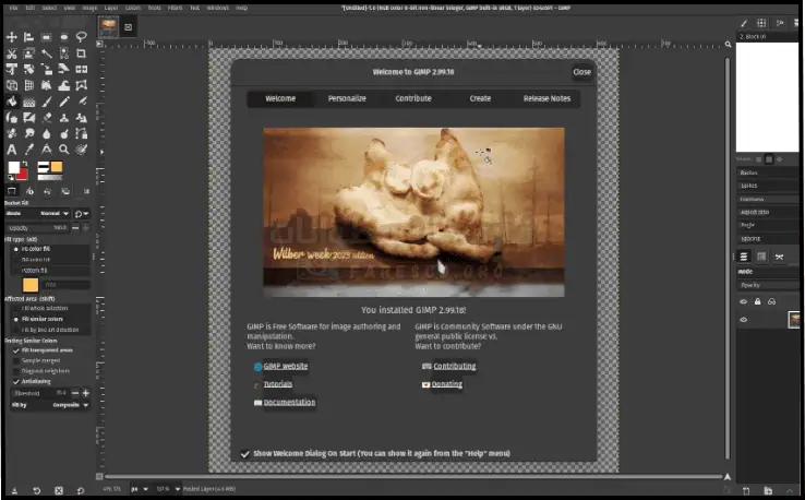 شعار تحميل Gimp على شاشة الكمبيوتر الشخصي، يعرض واجهة برنامج تحرير الصور مفتوح المصدر مع أدوات وخيارات متنوعة مرئية